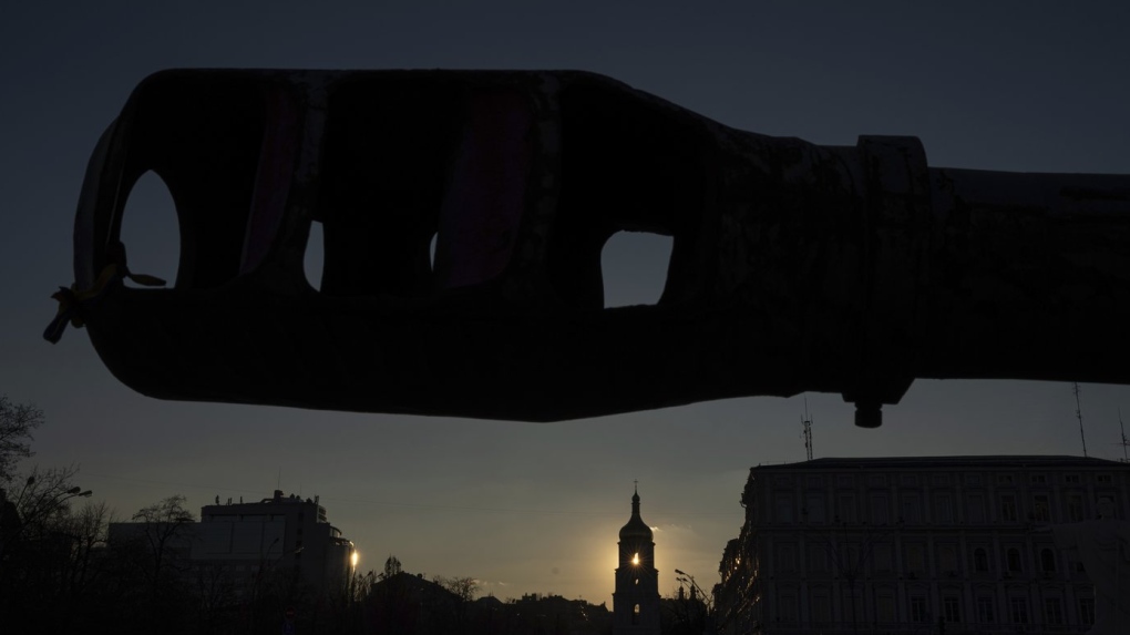 A bell tower of the Saint Sophia Cathedral is seen through the destroyed Russian artillery cannon in downtown Kyiv, Ukraine, on Monday, Jan. 29, 2024. (AP Photo/Evgeniy Maloletka)