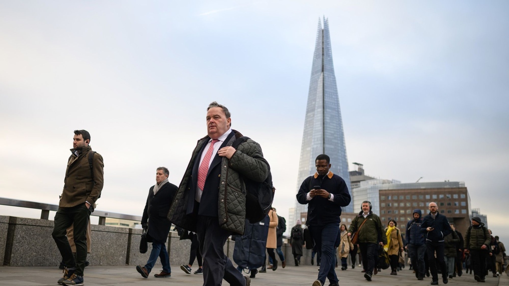 Commuters cross London Bridge during the morning rush hour on January 31, 2023, in London. (Leon Neal/Getty Images via CNN Newsource)
