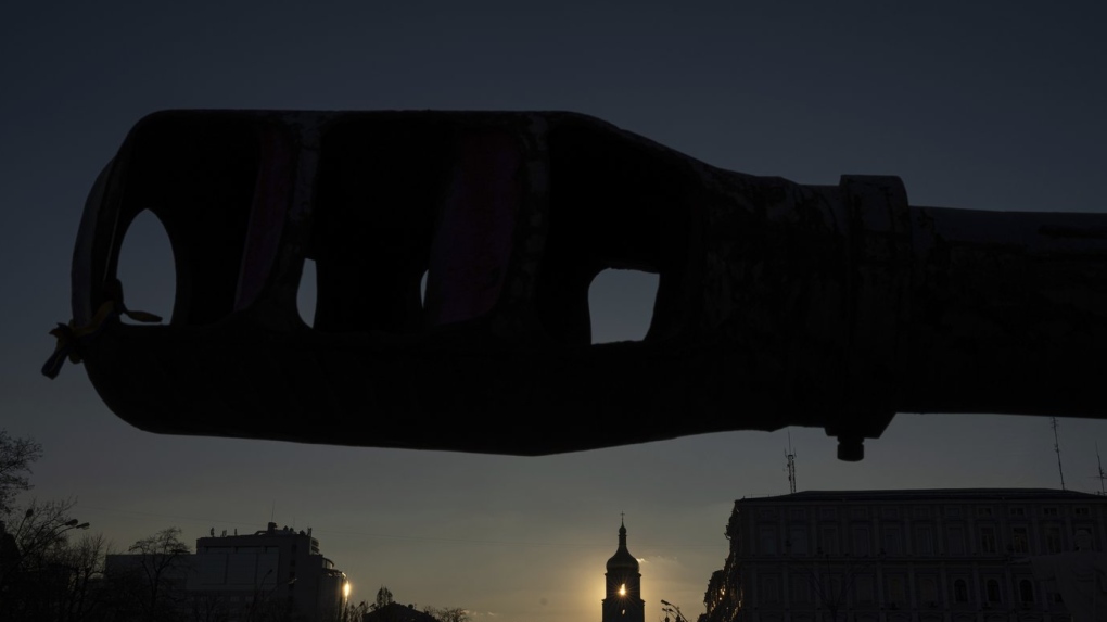 A bell tower of the Saint Sophia Cathedral is seen through the destroyed Russian artillery cannon in downtown Kyiv, Ukraine, on Monday, Jan. 29, 2024. (AP Photo/Evgeniy Maloletka)