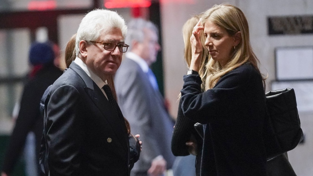 Rare book dealer Glenn Horowitz, left, is seen in the supreme court hallway during a break in proceedings, Wednesday, Feb. 21, 2024, in New York.  (AP Photo/Mary Altaffer)