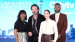 Cast members (left to right) Karen Robinson, Aden Young, Kathleen Munroe, and K.C. Collins pose for a photo at a press junket as they promote the television series "Law & Order Toronto: Criminal Intent" in Toronto on Tuesday, Feb. 20, 2024. THE CANADIAN PRESS/Chris Young