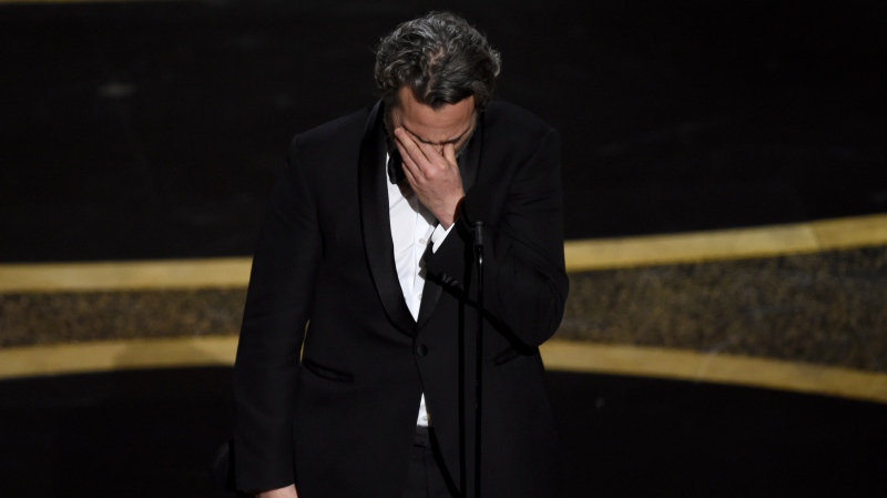 Joaquin Phoenix reacts as he accepts the award for best performance by an actor in a leading role for "Joker" at the Oscars on Sunday, Feb. 9, 2020, at the Dolby Theatre in Los Angeles. (AP Photo/Chris Pizzello)