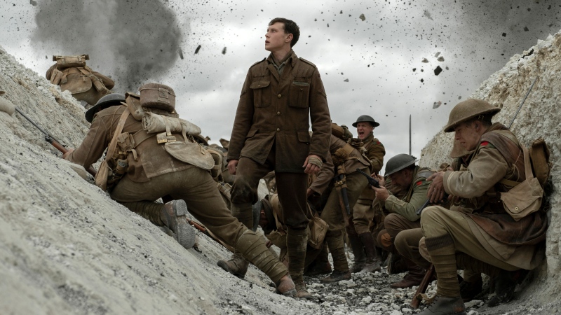 This image released by Universal Pictures shows George MacKay, center, in a scene from "1917," directed by Sam Mendes. (François Duhamel/Universal Pictures via AP)