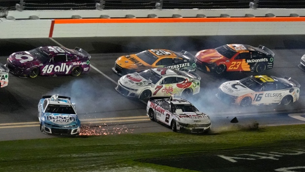 Ross Chastain (1), and Austin Cindric (2) slide through the ti-oval after crashing during the NASCAR Daytona 500 auto race Monday, Feb. 19, 2024, at Daytona International Speedway in Daytona Beach, Fla. (AP Photo/Chris O'Meara)