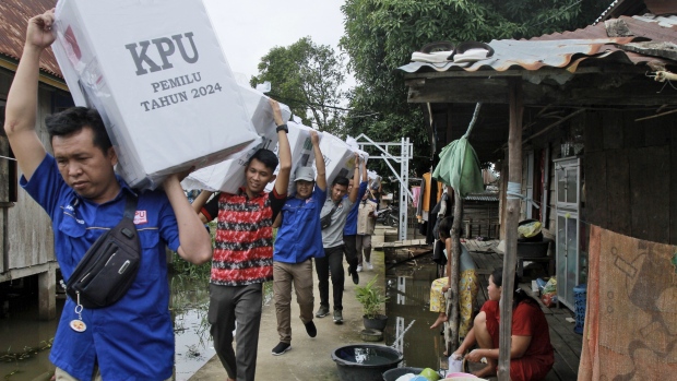 Electoral workers carry ballot boxes during the distribution of election paraphernalia to remote villages, in Pemulutan, South Sumatra, Indonesia, Tuesday, Feb. 13, 2024.<br><br>
Indonesia, the world's third-largest democracy, will open its polls on Wednesday, Feb. 14, to nearly 205 million eligible voters in presidential and legislative elections. Workers have been using motorbikes, horses and boats to distribute the ballot boxes to remote areas.<br><br>
(AP Photo/Muhammad Hatta)
