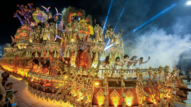 Dancers from the Dragoes da Real samba school perform on a float during a carnival parade in Sao Paulo early Saturday, Feb. 10, 2024.<br><br>
From Brazil's bedazzled samba dancers, to the Mardi Gras street party in New Orleans and Germany's satirical parade floats. Carnival season is in full swing and here's a look at how various countries celebrated their iconic festivals.<br><br>
(AP Photo/Andre Penner)
