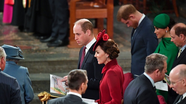 Prince Harry bows his head as the Monarch Queen Elizabeth II and Prince Charles, left, arrive to attend the annual Commonwealth Service at Westminster Abbey in London Monday March 9, 2020. (Phil Harris / Pool via AP)