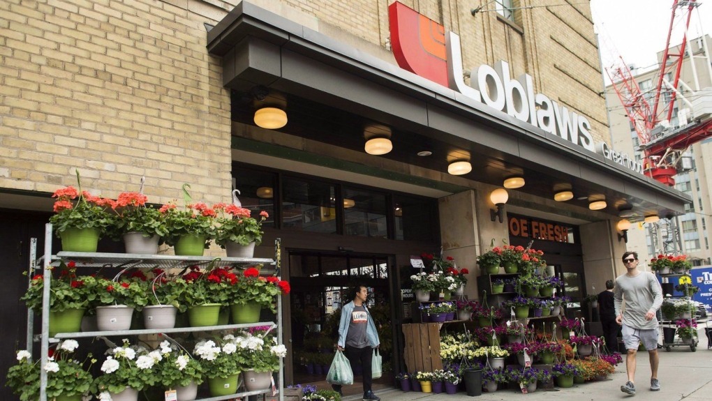 Loblaw Cos. Ltd. reported its fourth-quarter profit and sales rose compared with year ago. A man leaves a Loblaws store in Toronto on Thursday, May 3, 2018. THE CANADIAN PRESS/Nathan Denette