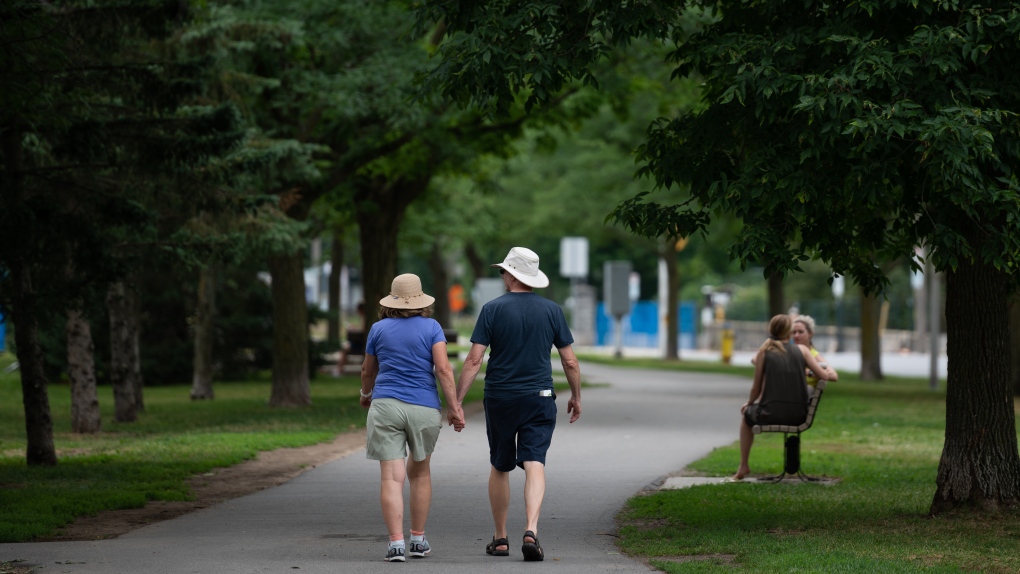 People are seen in the Ottawa neighbourhood of Westboro on Sunday, July 24, 2022. THE CANADIAN PRESS/Spencer Colby