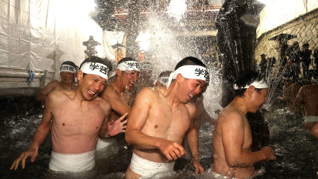 Participants purify themselves with cold water on Yamauchigawa river during Somin-sai festival at Kokusekiji Temple in Iwate prefecture, Japan on Feb. 17, 2024. (The Asahi Shimbun/Getty Images)