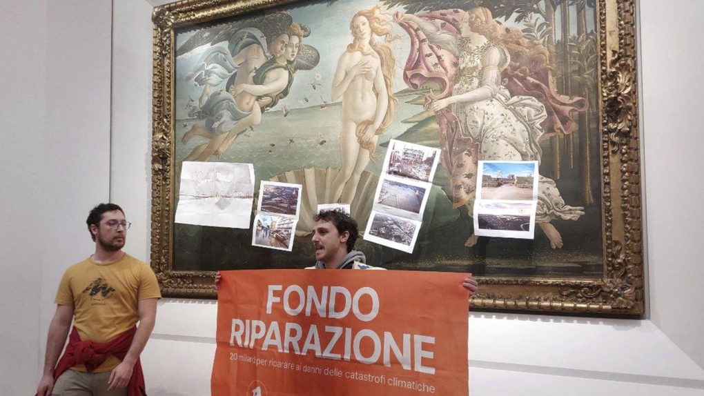 Activists from the Last Generation climate movement protest after attaching materials on the glass protecting Botticelli's 'The Birth of Venus' at Florence’s Uffizi Gallery in Florence, Italy, Tuesday Feb. 13, 2024. (Emiliano Benedetti, FirenzeToday via AP)