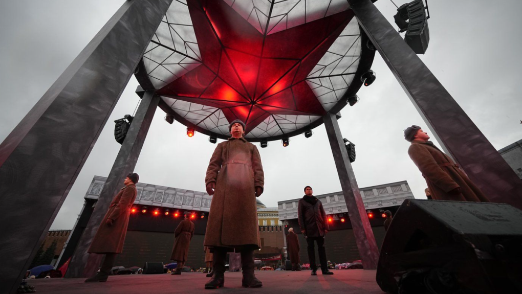 A participant dressed in Red Army World War II uniform in the role of a military traffic controller takes part in a theatrical performance at an open air interactive museum to commemorate the 82nd anniversary of the World War II-era parade, at Red Square, in Moscow, Russia, on Monday, Nov. 6, 2023. (AP Photo/Alexander Zemlianichenko, File)